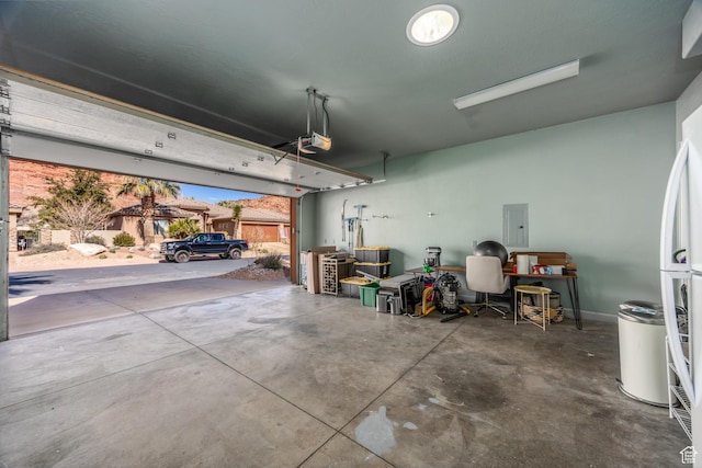 340 N Snow Canyon Dr Unit 4, Ivins, UT 84738 - garage with a garage door opener, freestanding refrigerator, and electric panel