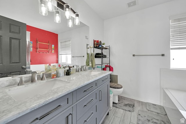 1087 N 1000 W, Clinton, UT 84015 - full bathroom with toilet, double vanity, a sink, and visible vents