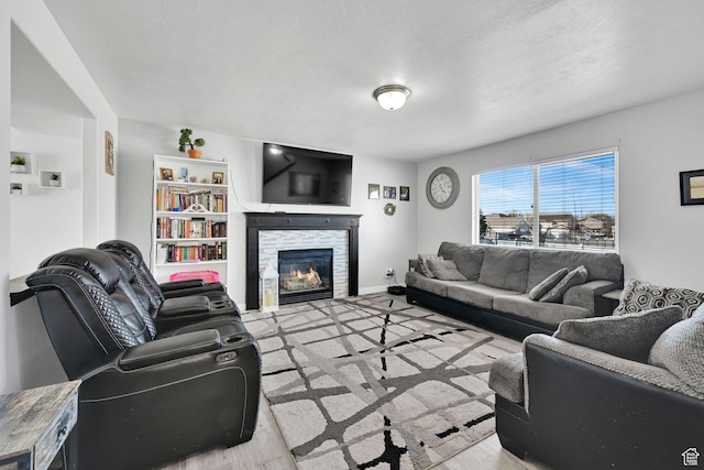 1087 N 1000 W, Clinton, UT 84015 - living room featuring a stone fireplace and baseboards