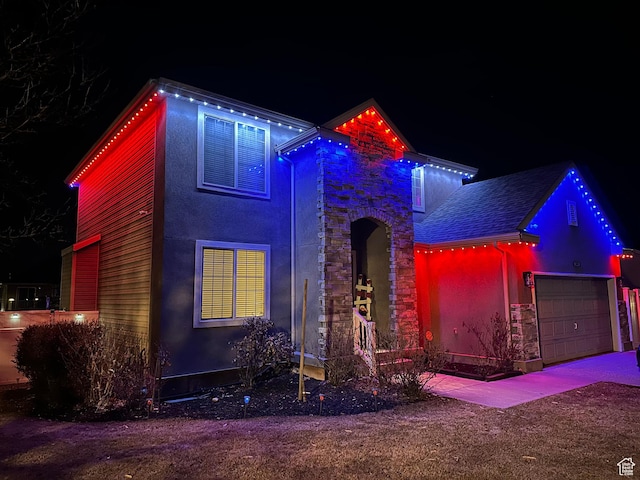 1087 N 1000 W, Clinton, UT 84015 - traditional-style home with a garage, stone siding, roof with shingles, and stucco siding