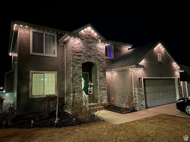 1087 N 1000 W, Clinton, UT 84015 - traditional-style home with a garage, stone siding, and stucco siding