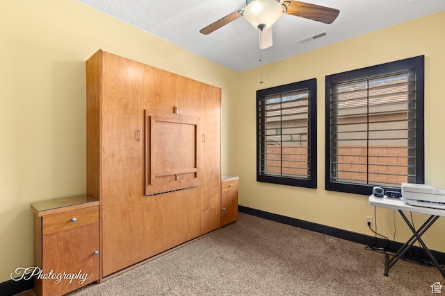 2275 E Rustic Dr, St George, UT 84790 - unfurnished bedroom featuring ceiling fan, carpet, visible vents, and baseboards