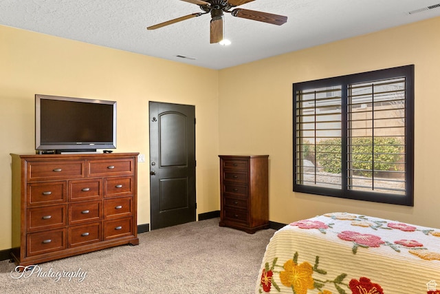 2275 E Rustic Dr, St George, UT 84790 - bedroom with light carpet, baseboards, visible vents, and a textured ceiling