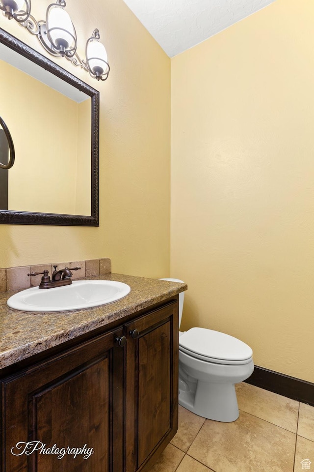 2275 E Rustic Dr, St George, UT 84790 - bathroom featuring toilet, tile patterned flooring, baseboards, and vanity