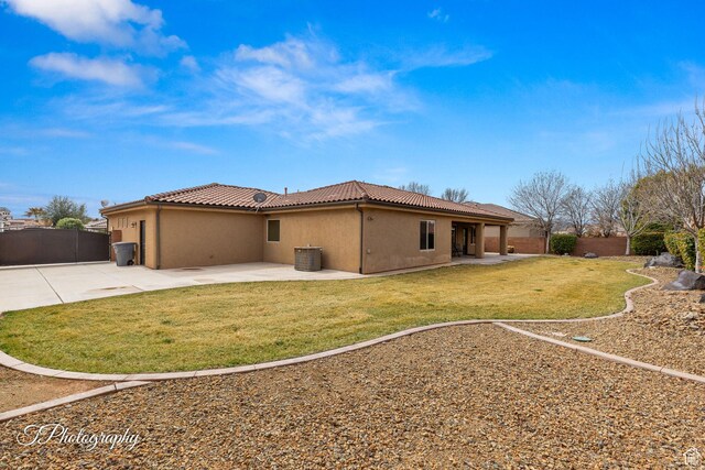 2275 E Rustic Dr, St George, UT 84790 - rear view of property featuring a patio, fence, a tile roof, a yard, and stucco siding