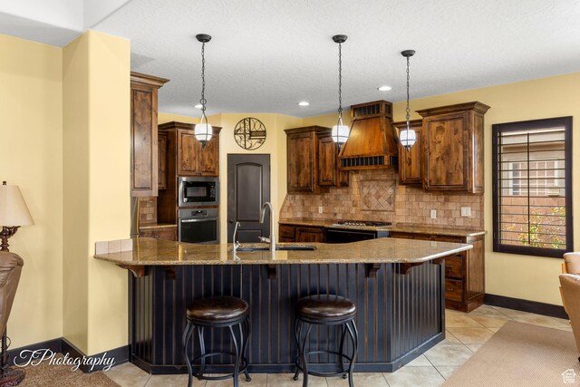 2275 E Rustic Dr, St George, UT 84790 - kitchen featuring oven, a sink, backsplash, built in microwave, and custom range hood