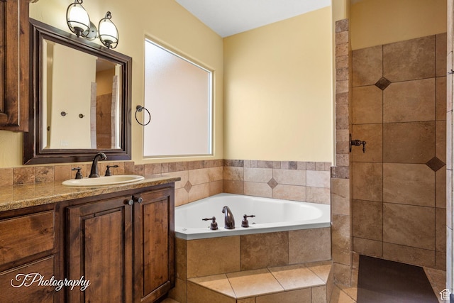 2275 E Rustic Dr, St George, UT 84790 - full bath featuring tiled shower, a bath, and vanity