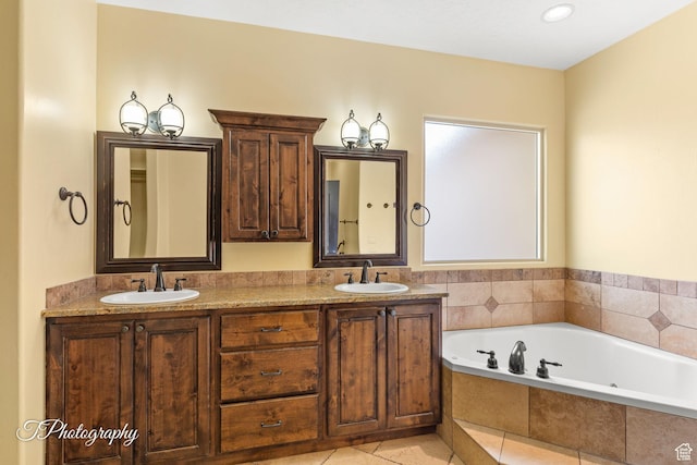 2275 E Rustic Dr, St George, UT 84790 - full bathroom with a garden tub, double vanity, a sink, and tile patterned floors