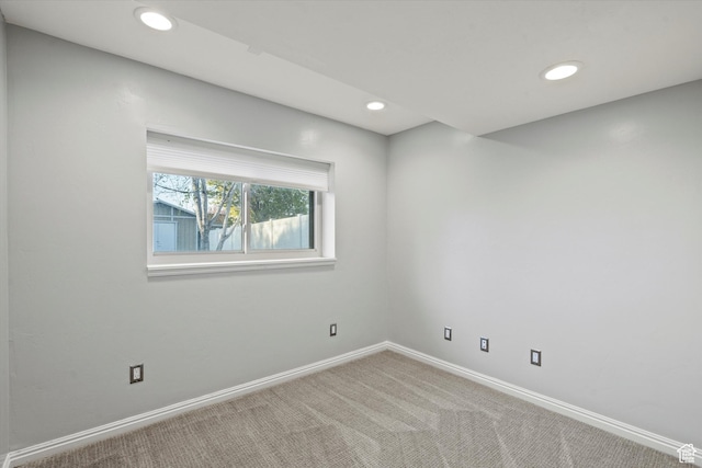 empty room with recessed lighting, carpet flooring, and baseboards