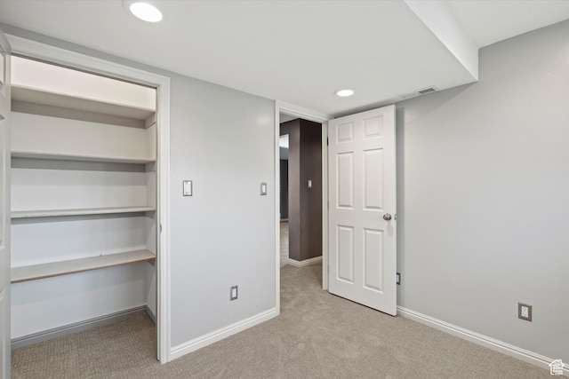 unfurnished bedroom featuring visible vents, baseboards, carpet flooring, and recessed lighting