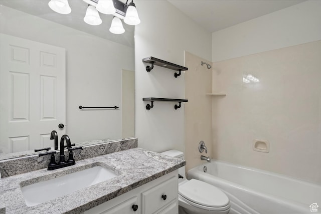 bathroom featuring tub / shower combination, toilet, and vanity