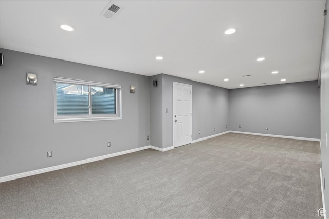 interior space with recessed lighting, carpet floors, visible vents, and baseboards