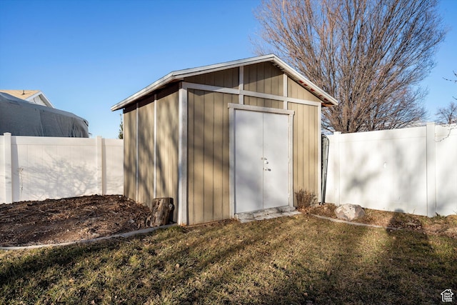 view of shed featuring fence