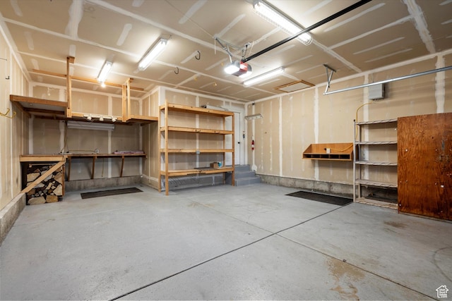 garage featuring a workshop area and a garage door opener
