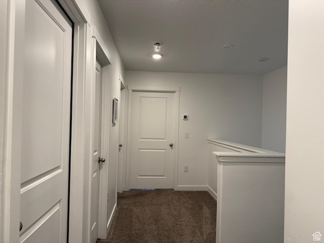 2810 N Fighting Falcon St, Layton, UT 84040 - corridor featuring dark carpet and baseboards