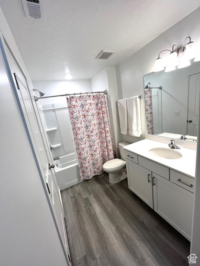 2810 N Fighting Falcon St, Layton, UT 84040 - full bathroom with shower / bathtub combination with curtain, vanity, visible vents, toilet, and wood finished floors