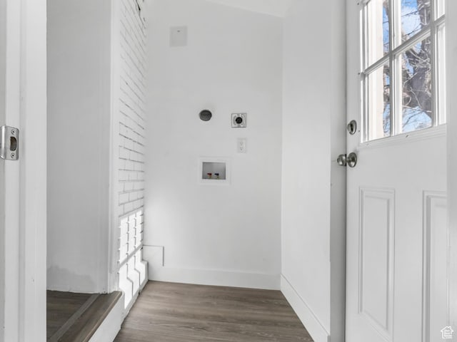 interior space featuring laundry area, baseboards, wood finished floors, hookup for a washing machine, and hookup for an electric dryer