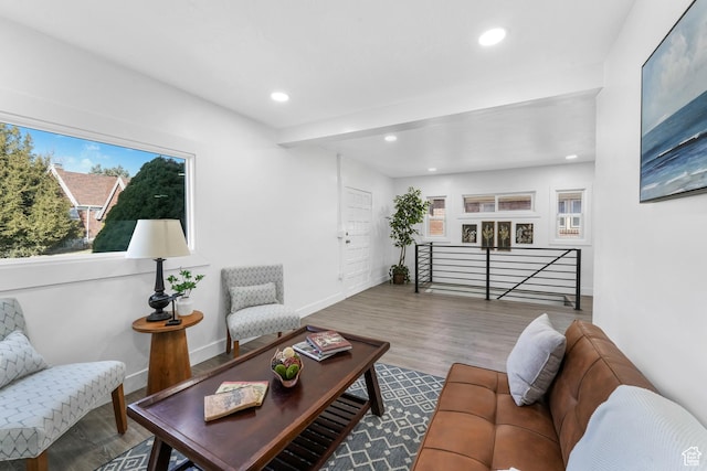 living room featuring recessed lighting, baseboards, and wood finished floors