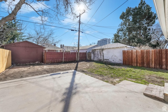 exterior space featuring an outbuilding and a fenced backyard