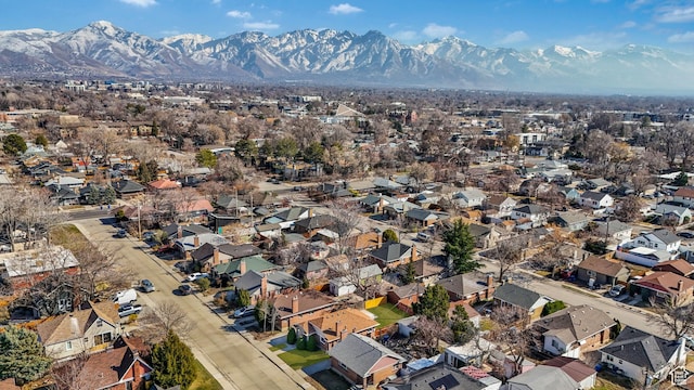 birds eye view of property with a residential view and a mountain view