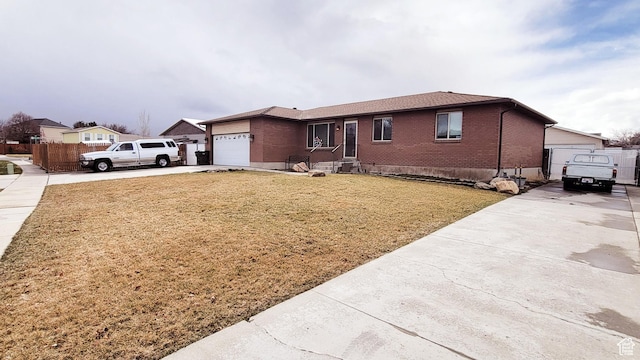 4142 S 3425 W, West Valley City, UT 84119 - ranch-style house featuring driveway, brick siding, and an attached garage