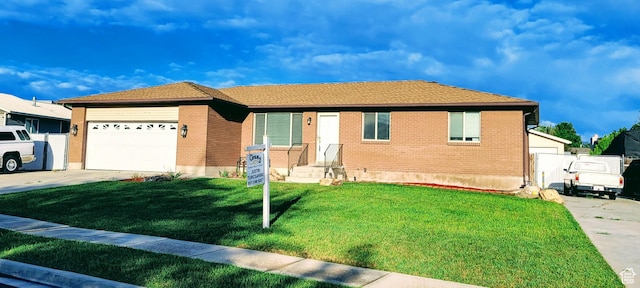 4142 S 3425 W, West Valley City, UT 84119 - single story home featuring driveway, an attached garage, a front lawn, and brick siding