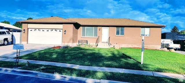 4142 S 3425 W, West Valley City, UT 84119 - ranch-style house featuring driveway, a garage, entry steps, and a front yard