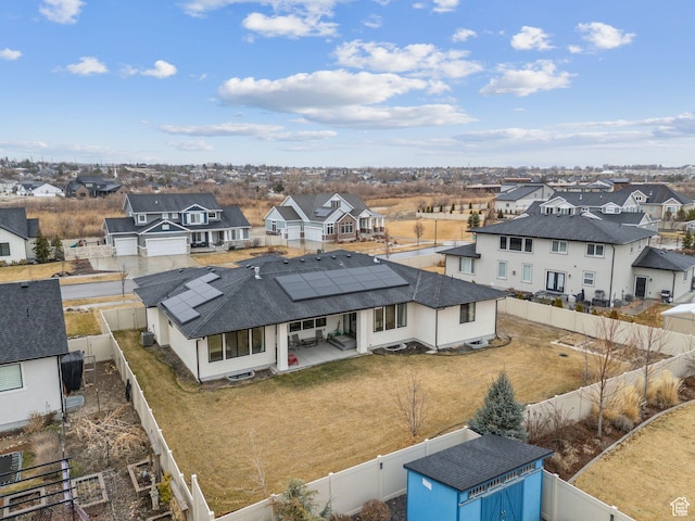 birds eye view of property with a residential view