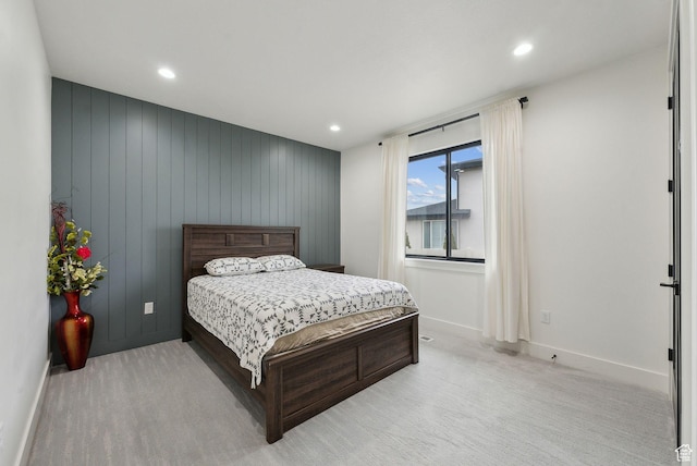 bedroom featuring recessed lighting, light colored carpet, and baseboards
