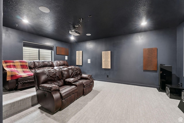 cinema room with carpet floors, baseboards, a textured ceiling, and recessed lighting