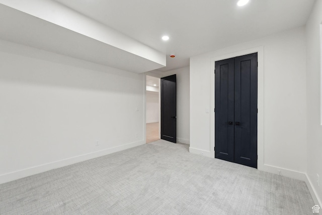 unfurnished bedroom with carpet floors, baseboards, and recessed lighting