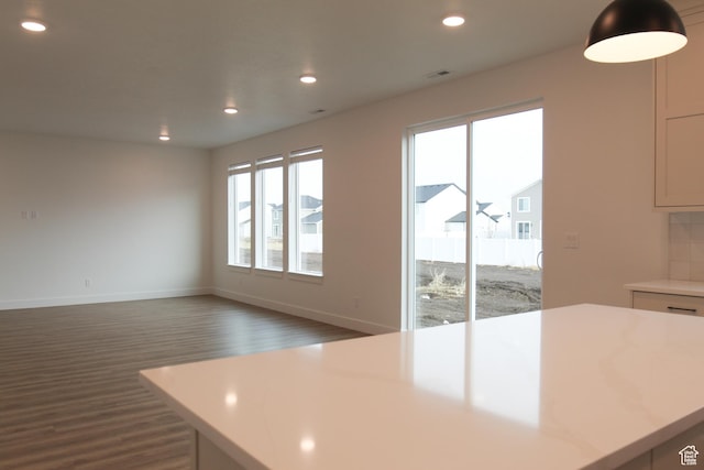 729 E 1250 S, Hyrum, UT 84319 - kitchen featuring dark wood-style flooring, light countertops, recessed lighting, a kitchen island, and baseboards