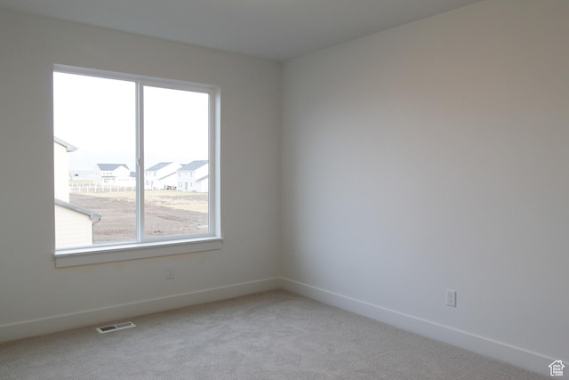729 E 1250 S, Hyrum, UT 84319 - unfurnished room featuring healthy amount of natural light, light colored carpet, and baseboards