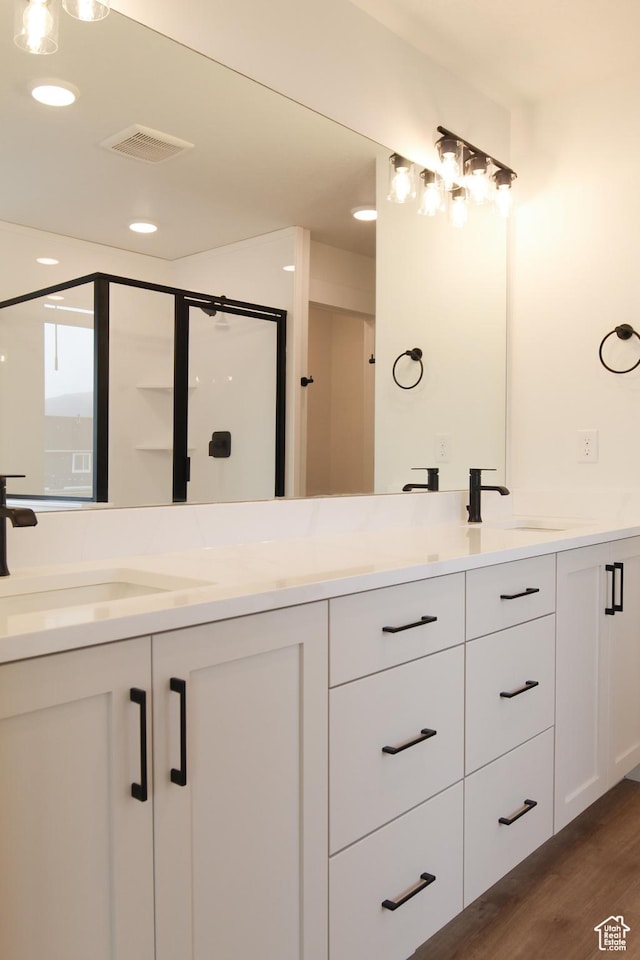 729 E 1250 S, Hyrum, UT 84319 - bathroom with double vanity, wood finished floors, recessed lighting, and a stall shower