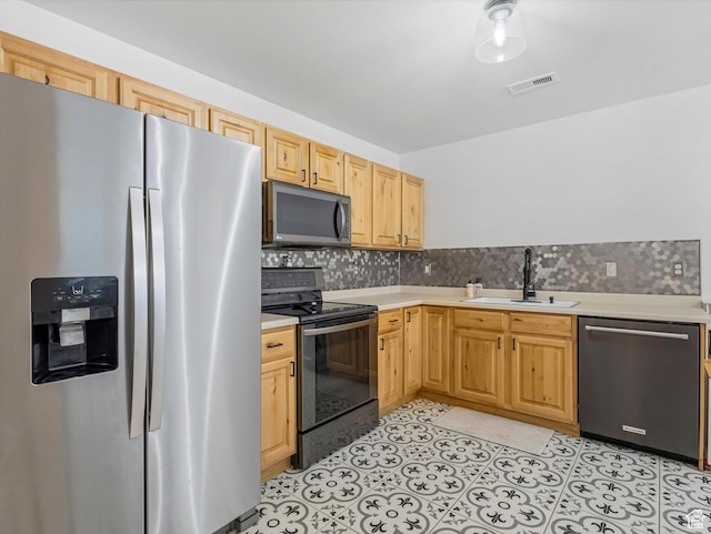 1673 N Aaron Dr E, Tooele, UT 84074 - kitchen featuring light countertops, appliances with stainless steel finishes, a sink, and visible vents