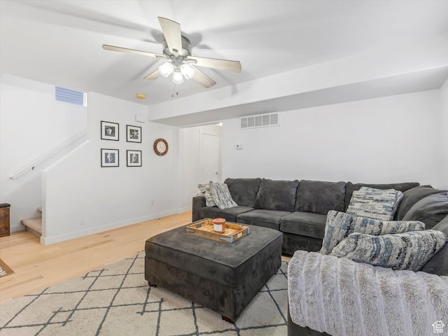 1673 N Aaron Dr E, Tooele, UT 84074 - living area with light wood-style flooring, visible vents, stairway, and a ceiling fan