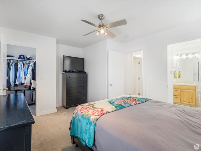 1673 N Aaron Dr E, Tooele, UT 84074 - bedroom with a closet, light colored carpet, a spacious closet, ensuite bath, and baseboards