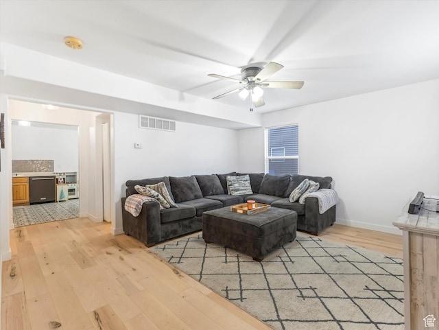 1673 N Aaron Dr E, Tooele, UT 84074 - living room with ceiling fan, baseboards, visible vents, and light wood-style floors