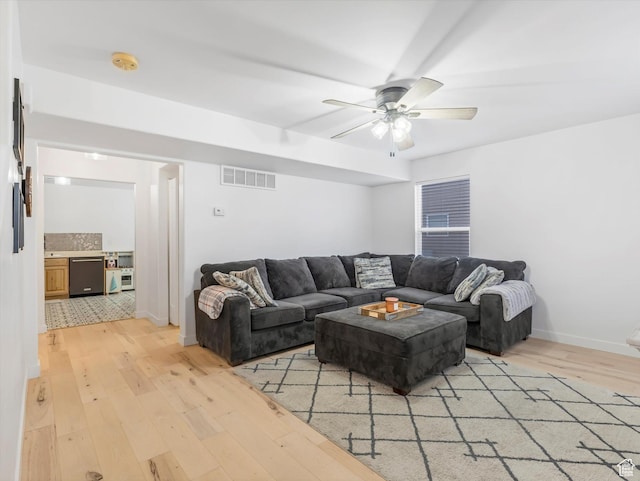 1673 N Aaron Dr E, Tooele, UT 84074 - living room featuring light wood-style floors, visible vents, baseboards, and a ceiling fan