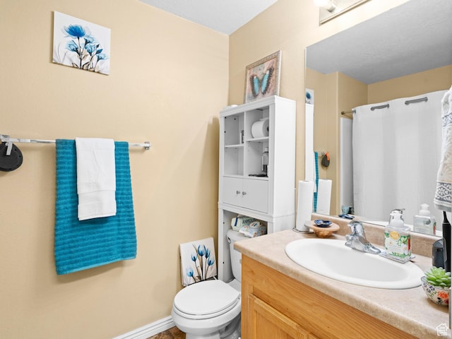 3478 S Cozy River Pl W Unit 203, West Valley City, UT 84119 - bathroom featuring curtained shower, baseboards, vanity, and toilet