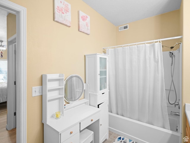3478 S Cozy River Pl W Unit 203, West Valley City, UT 84119 - bathroom with shower / bath combo, visible vents, vanity, and ensuite bath
