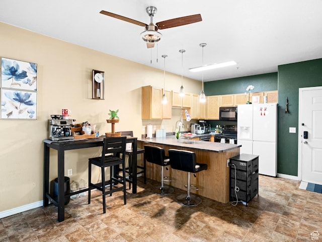 3478 S Cozy River Pl W Unit 203, West Valley City, UT 84119 - kitchen featuring light brown cabinets, a sink, black appliances, a peninsula, and baseboards