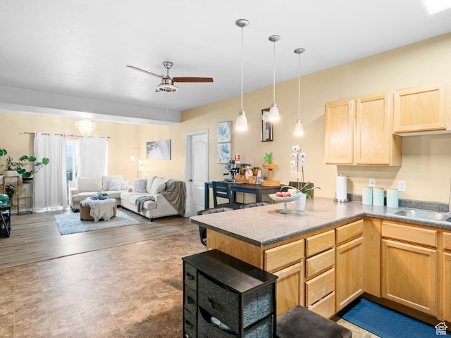 3478 S Cozy River Pl W Unit 203, West Valley City, UT 84119 - kitchen featuring ceiling fan, light brown cabinets, a peninsula, a sink, and open floor plan