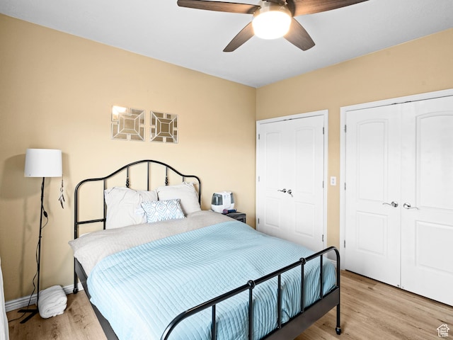 3478 S Cozy River Pl W Unit 203, West Valley City, UT 84119 - bedroom featuring a closet, baseboards, ceiling fan, and light wood finished floors