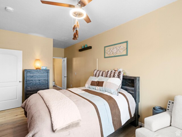 3478 S Cozy River Pl W Unit 203, West Valley City, UT 84119 - bedroom with a ceiling fan and wood finished floors