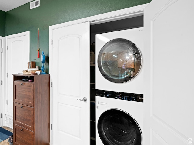 3478 S Cozy River Pl W Unit 203, West Valley City, UT 84119 - laundry room featuring visible vents, laundry area, and stacked washer and clothes dryer