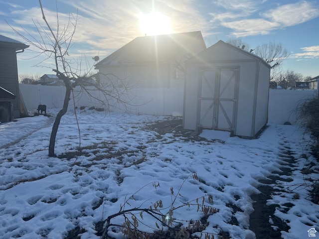564 W 475 N, Clearfield, UT 84015 - snow covered structure featuring fence, an outbuilding, and a storage shed
