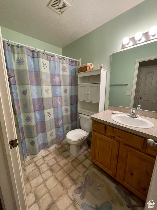 564 W 475 N, Clearfield, UT 84015 - bathroom featuring tile patterned flooring, toilet, vanity, visible vents, and a textured ceiling
