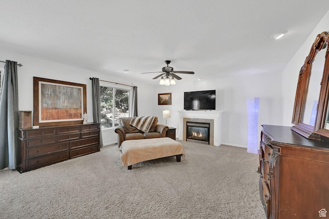654 E 3225 N, North Ogden, UT 84414 - living area featuring a glass covered fireplace, carpet flooring, ceiling fan, and baseboards