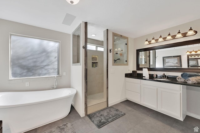 654 E 3225 N, North Ogden, UT 84414 - bathroom with tiled shower, a freestanding bath, vanity, and baseboards